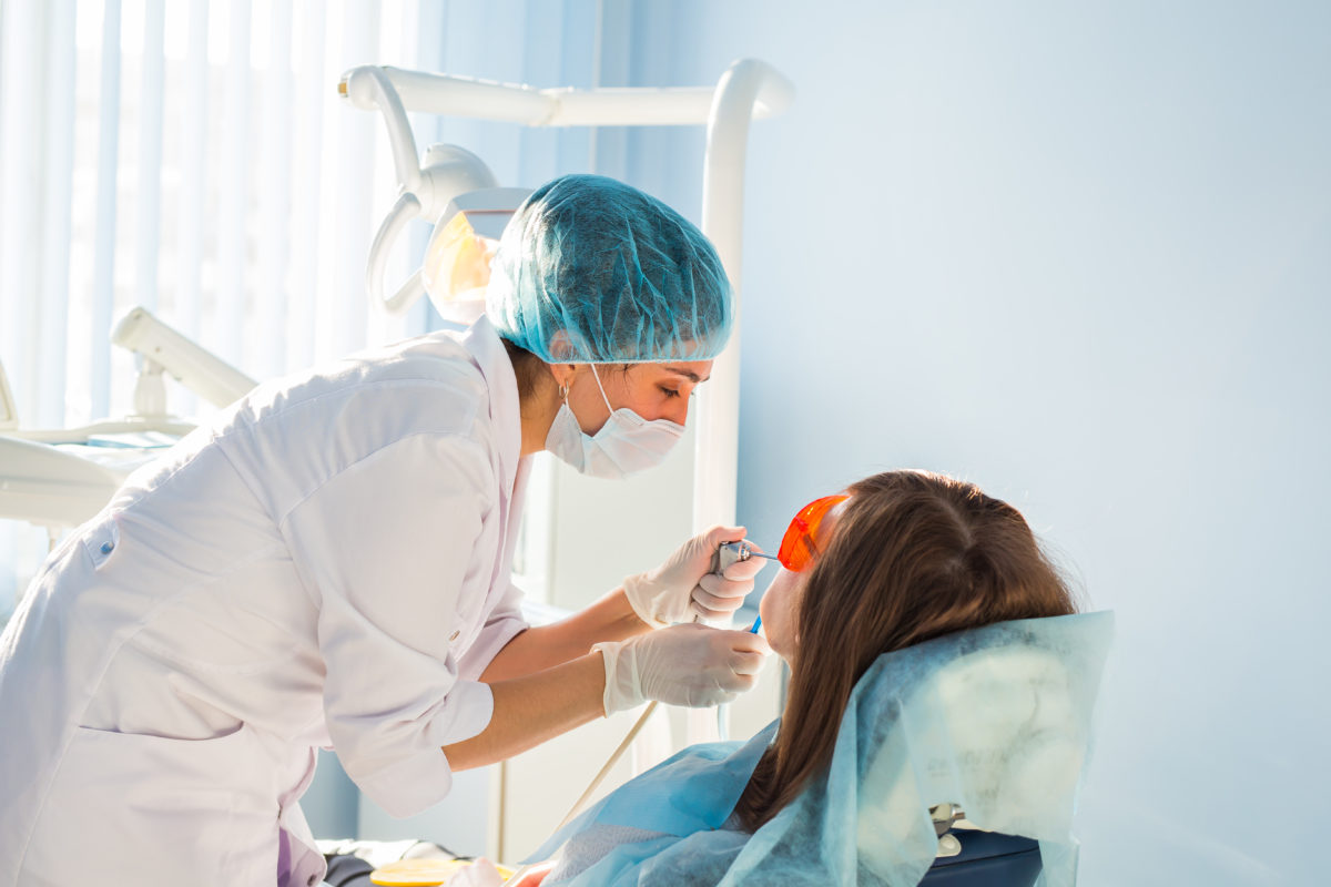 young-woman-getting-dental-treatment-dental-clini-2021-04-04-09-57-25-utc-1200x800.jpg